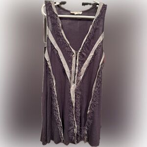 Purple Sleeveless 1/4 zip tank with Fringe Details.